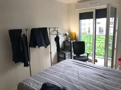Un ou plusieurs lits dans un hébergement de l'établissement Cozy apartment in Paris Clichy