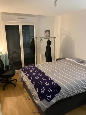 Un ou plusieurs lits dans un hébergement de l'établissement Cozy apartment in Paris Clichy