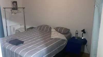Un ou plusieurs lits dans un hébergement de l'établissement Cozy apartment in Paris Clichy
