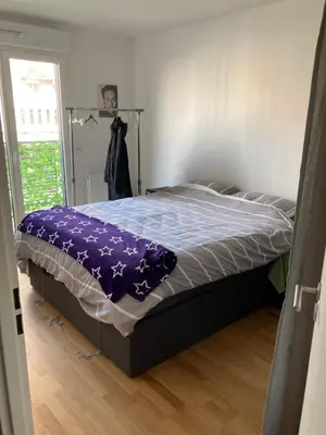 Un ou plusieurs lits dans un hébergement de l'établissement Cozy apartment in Paris Clichy
