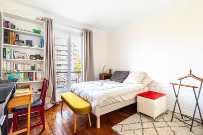 Un ou plusieurs lits dans un hébergement de l'établissement GuestReady - Estadia maravilhosa perto do Père-Lachaise