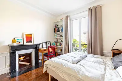 Un ou plusieurs lits dans un hébergement de l'établissement GuestReady - Estadia maravilhosa perto do Père-Lachaise