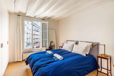 Un ou plusieurs lits dans un hébergement de l'établissement GuestReady - Séjour confortable dans le 9ème