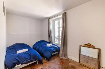 Un ou plusieurs lits dans un hébergement de l'établissement GuestReady - Séjour confortable dans le 9ème