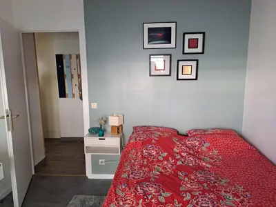Un ou plusieurs lits dans un hébergement de l'établissement Appartement cosy avec jardin et parking