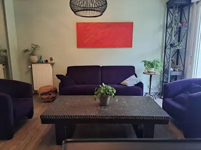 Coin salon dans l'établissement Appartement cosy avec jardin et parking