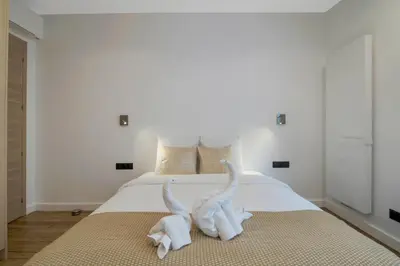 Un ou plusieurs lits dans un hébergement de l'établissement Premium Suites - Arc de Triomphe - Trocadéro