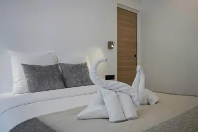 Un ou plusieurs lits dans un hébergement de l'établissement Premium Suites - Arc de Triomphe - Trocadéro