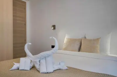Un ou plusieurs lits dans un hébergement de l'établissement Premium Suites - Arc de Triomphe - Trocadéro