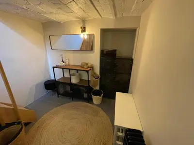 Télévision ou salle de divertissement dans l'établissement Le refuge du 15