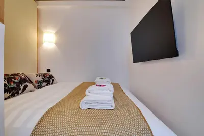 Un ou plusieurs lits dans un hébergement de l'établissement Dream Home near Sacre Coeur