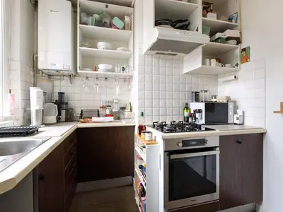 Cuisine ou kitchenette dans l'établissement Apartment in Paris near Line 14 Metro
