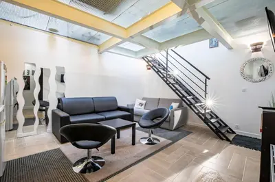 Coin salon dans l'établissement Comme à la Maison