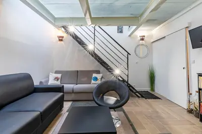 Coin salon dans l'établissement Comme à la Maison