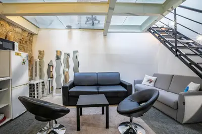 Coin salon dans l'établissement Comme à la Maison