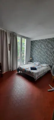 Un ou plusieurs lits dans un hébergement de l'établissement Studio Rue st Martin