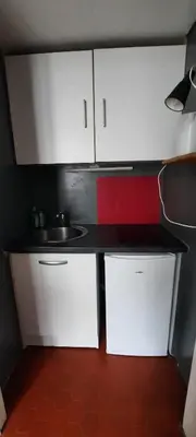 Cuisine ou kitchenette dans l'établissement Studio Rue st Martin