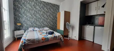 Un ou plusieurs lits dans un hébergement de l'établissement Studio Rue st Martin