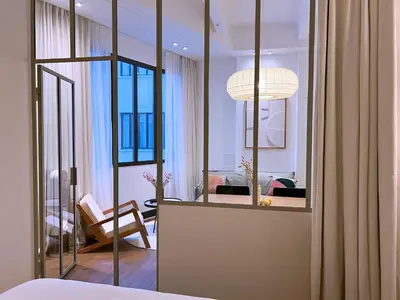 Un ou plusieurs lits dans un hébergement de l'établissement Art Deco Loft - 2BR and 2BA near Canal Saint Martin