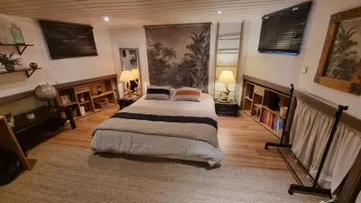 Un ou plusieurs lits dans un hébergement de l'établissement Logement vue sur la seine