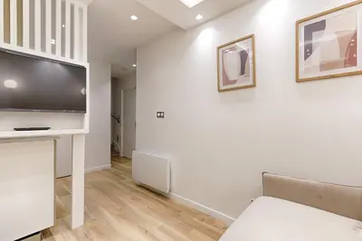 Télévision ou salle de divertissement dans l'établissement Coeur du Marais Arts&Metiers Magnifique Appartement