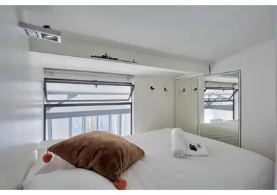 Un ou plusieurs lits dans un hébergement de l'établissement Duplex Center of Paris by Studio prestige