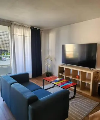 Télévision ou salle de divertissement dans l'établissement Appartement La Défense