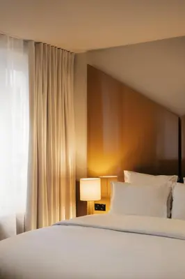Un ou plusieurs lits dans un hébergement de l'établissement Edgar Suites - Bouchardon