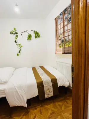 Un ou plusieurs lits dans un hébergement de l'établissement two-bedroom flat near Pompidou Centre