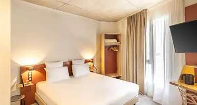 Un ou plusieurs lits dans un hébergement de l'établissement Best Western 11BAUER Paris Saint-Ouen