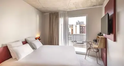 Un ou plusieurs lits dans un hébergement de l'établissement Best Western 11BAUER Paris Saint-Ouen