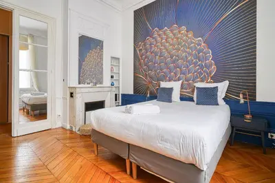 Un ou plusieurs lits dans un hébergement de l'établissement Apartment Arc de Triomphe Champs Elysées