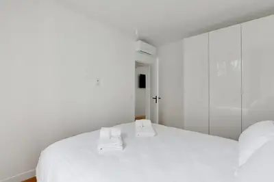 Un ou plusieurs lits dans un hébergement de l'établissement Pick A Flat's Apartement in Nation - rue d'Avron