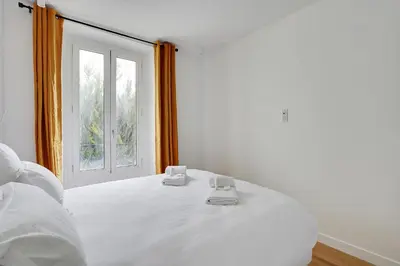 Un ou plusieurs lits dans un hébergement de l'établissement Pick A Flat's Apartement in Nation - rue d'Avron