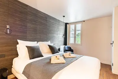 Un ou plusieurs lits dans un hébergement de l'établissement Loft Unique - Opéra / Palais Royal - 2 chambres
