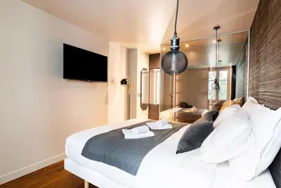 Un ou plusieurs lits dans un hébergement de l'établissement Loft Unique - Opéra / Palais Royal - 2 chambres