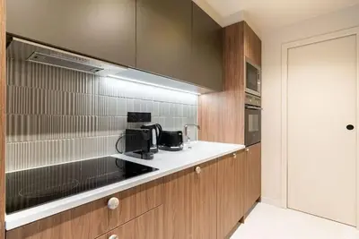 Cuisine ou kitchenette dans l'établissement Loft Unique - Opéra / Palais Royal - 2 chambres