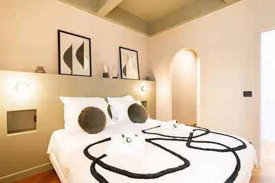 Un ou plusieurs lits dans un hébergement de l'établissement Loft Unique - Opéra / Palais Royal - 2 chambres