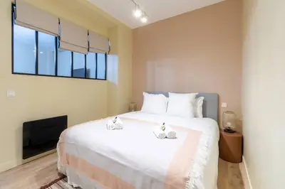 Un ou plusieurs lits dans un hébergement de l'établissement Nouveau - Designer Appartement - 6p