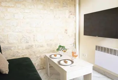 Télévision ou salle de divertissement dans l'établissement Unique Studio in Marais