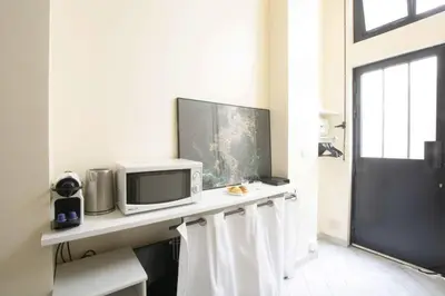 Télévision ou salle de divertissement dans l'établissement Unique Studio in Marais