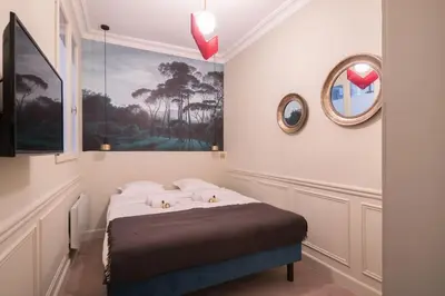 Un ou plusieurs lits dans un hébergement de l'établissement Modern and Cosy flat in the heart of Notre Dame