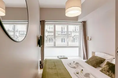 Un ou plusieurs lits dans un hébergement de l'établissement Modern 2 bedrooms near Louvre