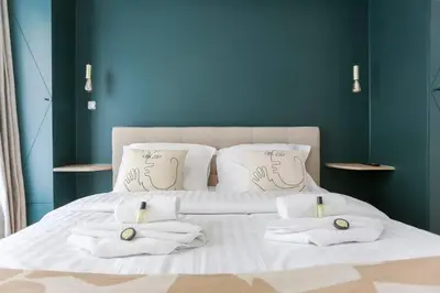 Un ou plusieurs lits dans un hébergement de l'établissement Modern 2 bedrooms near Louvre