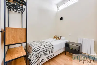 Un ou plusieurs lits dans un hébergement de l'établissement Urban Flat 159 - Charming 3BDR Flat in Paris