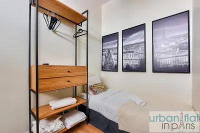 Un ou plusieurs lits dans un hébergement de l'établissement Urban Flat 159 - Charming 3BDR Flat in Paris