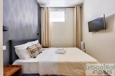 Un ou plusieurs lits dans un hébergement de l'établissement Urban Flat 159 - Charming 3BDR Flat in Paris