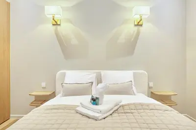Un ou plusieurs lits dans un hébergement de l'établissement Apartment Le Marais by Studio prestige