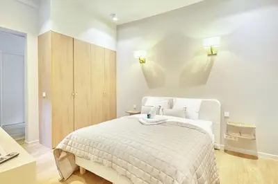 Un ou plusieurs lits dans un hébergement de l'établissement Apartment Le Marais by Studio prestige