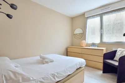 Un ou plusieurs lits dans un hébergement de l'établissement Appartement Olympe - Welkeys